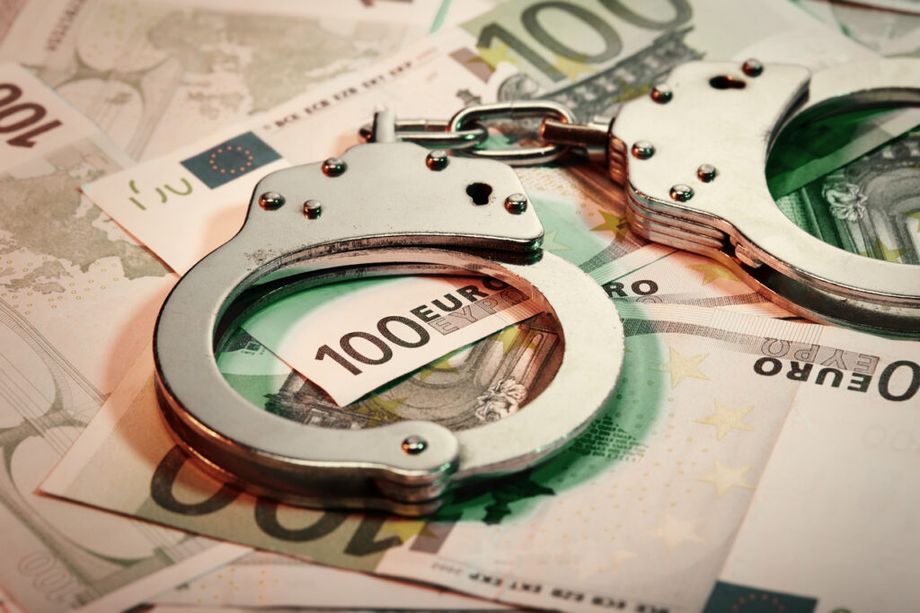 GeldwÃ¤sche Handcuffs and Euro banknotes