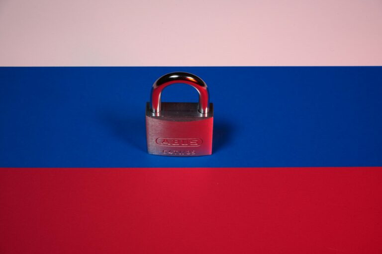a red, white and blue background with a padlock