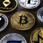 Detailed view of assorted cryptocurrency coins including Bitcoin, Ethereum, and Ripple.