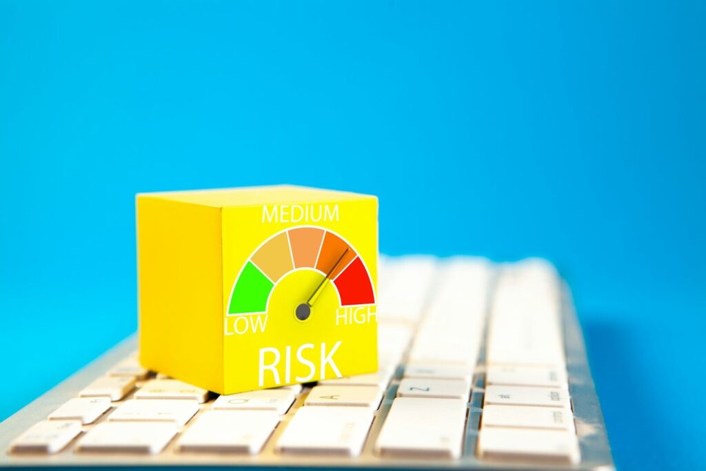 Yellow cube with risk meter on keyboard