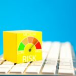 Yellow cube with risk meter on keyboard