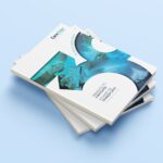 a stack of four business cards on a blue background